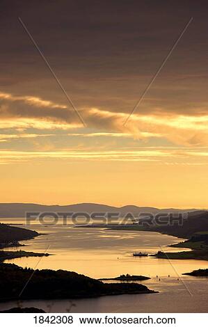 Sunset over water, Argyll and Bute, Scotland View Large Photo Image Stock Photo - Sunset over water, Argyll and Bute, Scotland. Fotosearch