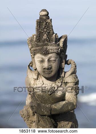 Tanah Lot Sea Temple, Bali, Indonesia; Stone statue View Large Photo Image Stock Photo - Tanah Lot Sea Temple, Bali, Indonesia; Stone statue. Fotosearch