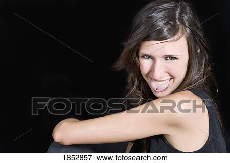 Teenage Girl Portrait; pierced tongue and lip View Large Photo Image Stock Photo - Teenage Girl Portrait; pierced tongue and lip . Fotosearch