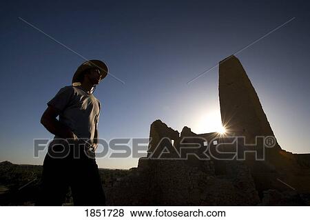 Stock Photo - Tourist, Aghurmi, Siwa Oasis, Egypt; A male tourist at the remains of the oracle temple of Amun. Fotosearch