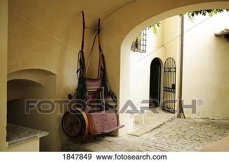 Tuscany, Italy; Horse drawn carriage hanging View Large Photo Image Stock Photo - Tuscany, Italy; Horse drawn carriage hanging. Fotosearch