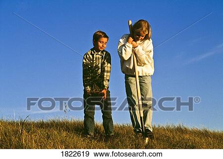 Stock Photo - Two children in a field. Fotosearch