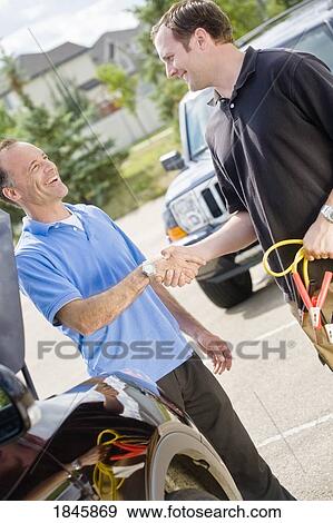 Stock Photo - Two men shaking hands. Fotosearch