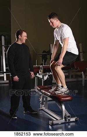 Two men working out View Large Photo Image Stock Image - Two men working out. Fotosearch