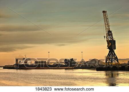 Stock Image - Tyne and Wear, Sunderland, England; Crane at a shipping dock. Fotosearch