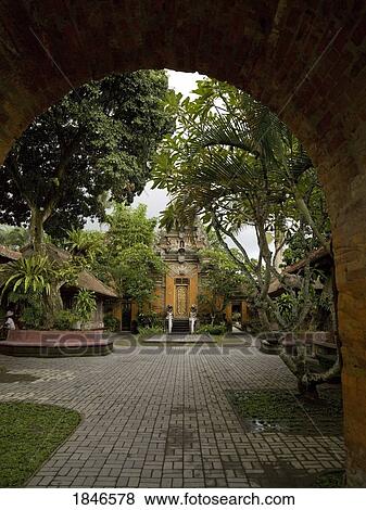 Stock Photo - Ubud, Bali, Indonesia; Paths through temple courtyard. Fotosearch