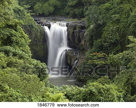 Waterfall flowing into a river, Bali, Indonesia View Large Photo Image Stock Photo - Waterfall flowing into a river, Bali, Indonesia. Fotosearch