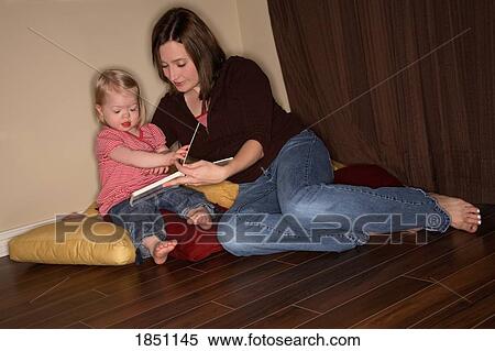 Woman and girl; Mother and daughter reading together View Large Photo Image Stock Photography - Woman and girl; Mother and daughter reading together. Fotosearch