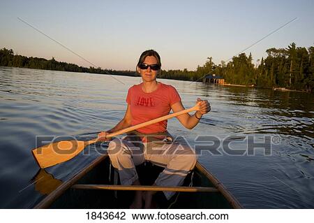 Woman canoeing View Large Photo Image Stock Image - Woman canoeing. Fotosearch