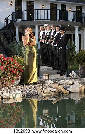 Woman in a formal dress; Woman making a choice in men View Large Photo Image Stock Photo - Woman in a formal dress; Woman making a choice in men. Fotosearch