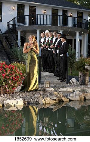 Woman in a formal dress; Woman making a choice in men View Large Photo Image Stock Photo - Woman in a formal dress; Woman making a choice in men. Fotosearch
