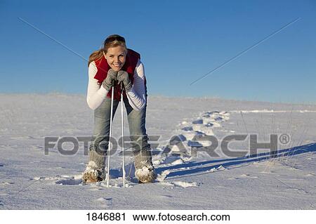 Woman in snowshoes View Large Photo Image Stock Image - Woman in snowshoes. Fotosearch