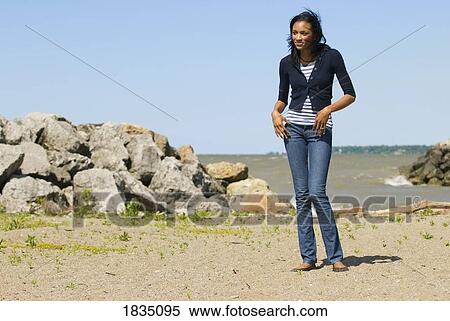 Stock Photography - Woman on a beach . Fotosearch