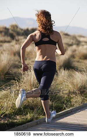 Woman running View Large Photo Image Stock Photo - Woman running. Fotosearch