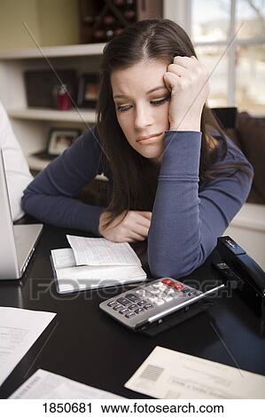 Stock Image - Woman with financial stress. Fotosearch