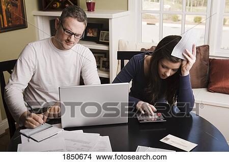 Young couple with financial stress View Large Photo Image Picture - Young couple with financial stress. Fotosearch