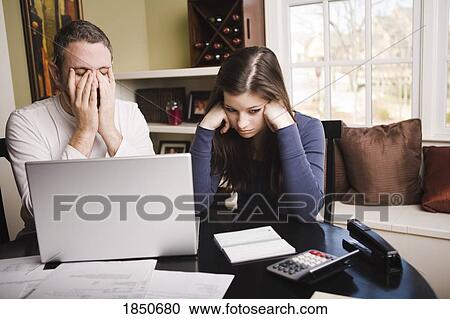 Young couple with financial stress View Large Photo Image Stock Image - Young couple with financial stress. Fotosearch