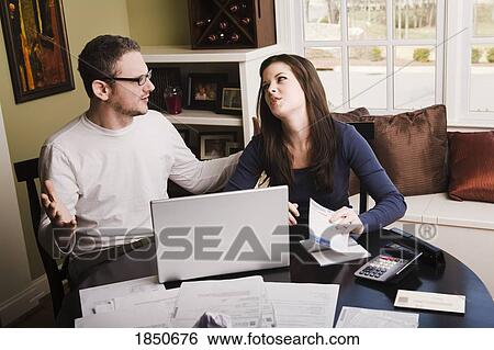 Stock Photograph - Young couple with financial stress. Fotosearch