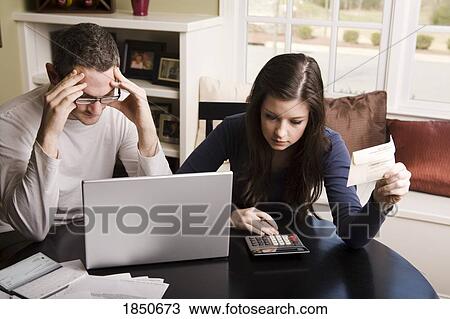 Stock Image - Young couple with laptop. Fotosearch
