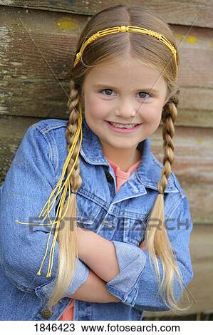 Young girl with braids; Portrait of a Girl View Large Photo Image Stock Image - Young girl with braids; Portrait of a Girl. Fotosearch