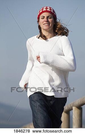 Young woman jogging View Large Photo Image Stock Photo - Young woman jogging. Fotosearch