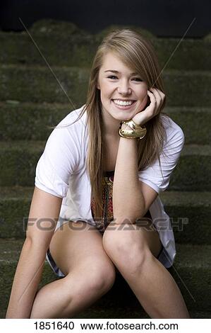 Stock Image - Young woman; Portrait of a young woman. Fotosearch