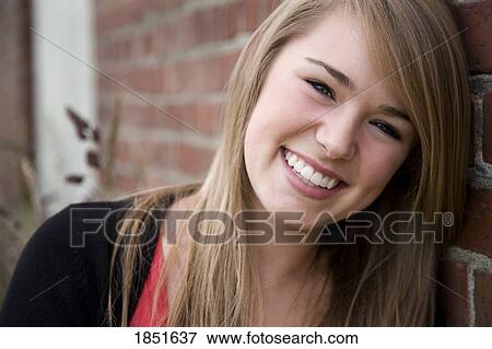 Stock Photo - Young woman; Portrait of a young woman. Fotosearch