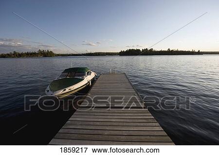 Boat and dock, Lake of the Woods, Ontario, Canada View Large Photo Image Stock Photo - Boat and dock, Lake of the Woods, Ontario, Canada. Fotosearch