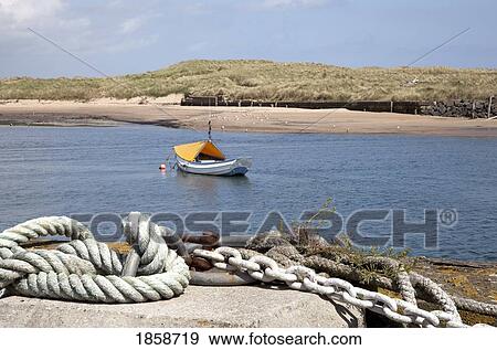 Stock Photo - Boat in water; Amble Harbour, Northumberland, England. Fotosearch