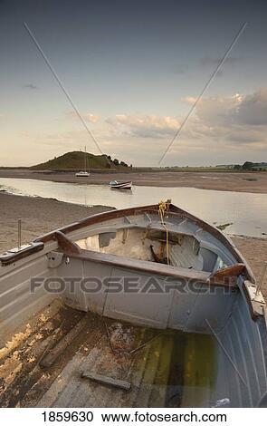 Stock Image - Boat on shore, Alnmouth, Northumberland, England. Fotosearch
