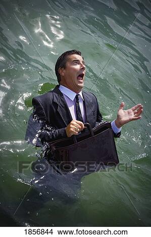 Picture - Businessman drowning in water. Fotosearch