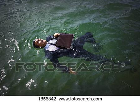 Businessman in the water View Large Photo Image Stock Image - Businessman in the water. Fotosearch