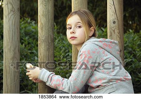 Picture - Child eating a sandwich. Fotosearch