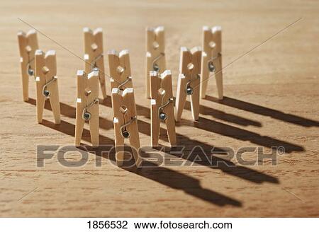 Stock Image - Clothespins standing in a triangle. Fotosearch