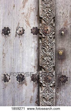Detail of carved wooden door in Lamu, Kenya View Large Photo Image Stock Image - Detail of carved wooden door in Lamu, Kenya. Fotosearch