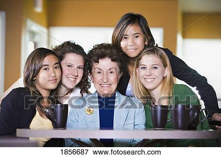 Elderly woman surrounded by young friends View Large Photo Image Stock Photo - Elderly woman surrounded by young friends. Fotosearch
