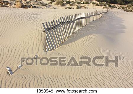 Fence in the sand; Bolongna, Andalucia, Spain View Large Photo Image Stock Photography - Fence in the sand; Bolongna, Andalucia, Spain. Fotosearch