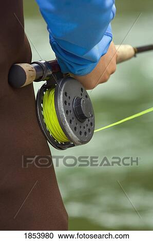 Stock Image - Fly fishing rod and reel handle, Nordegg, Alberta, Canada. Fotosearch