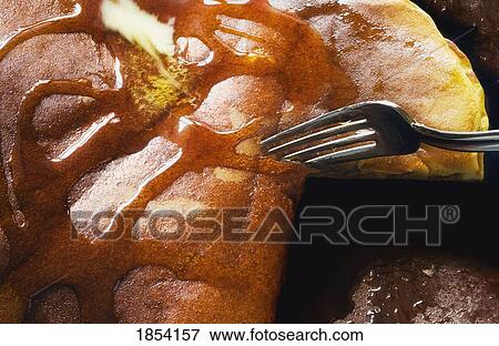 Fork cutting into a pancake View Large Photo Image Stock Photo - Fork cutting into a pancake. Fotosearch