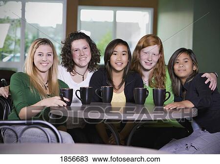 Friends having coffee together View Large Photo Image Stock Image - Friends having coffee together. Fotosearch
