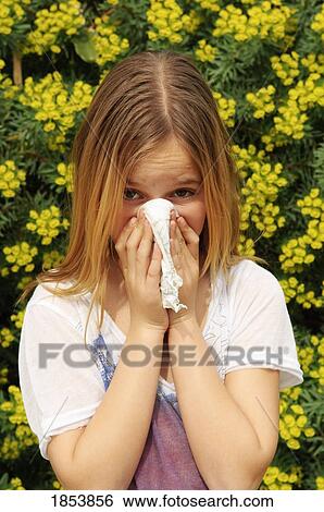 Girl blowing her nose View Large Photo Image Stock Photograph - Girl blowing her nose. Fotosearch