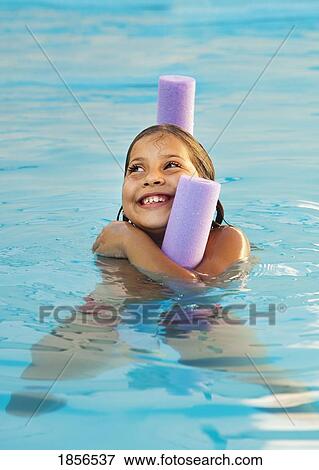 Stock Photo - Girl playing in a pool. Fotosearch