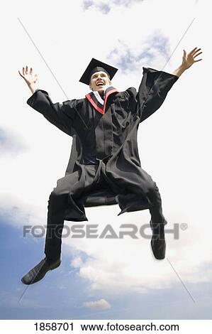Stock Image - Graduate celebrating. Fotosearch