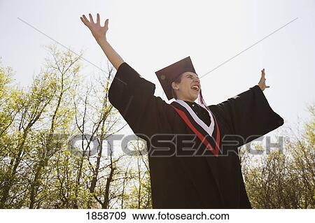 Stock Photo - Graduate celebrating success. Fotosearch