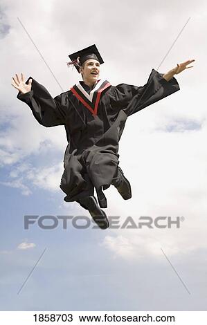 Stock Image - Graduate jumping high. Fotosearch