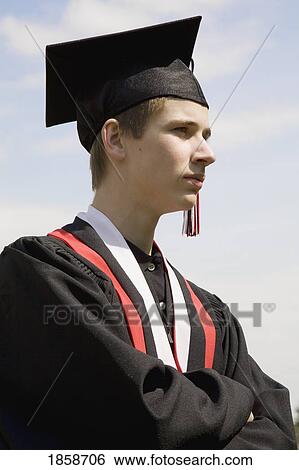 Graduate looking into the distance View Large Photo Image Stock Photograph - Graduate looking into the distance. Fotosearch