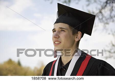 Graduate looking up View Large Photo Image Stock Photo - Graduate looking up. Fotosearch