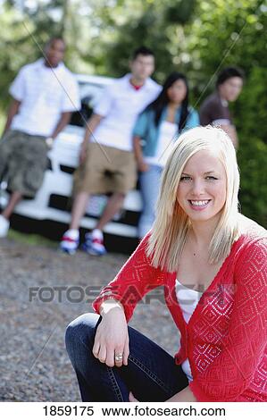 Happy woman, separate from her friends View Large Photo Image Stock Photography - Happy woman, separate from her friends. Fotosearch