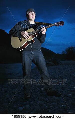Man playing guitar View Large Photo Image Stock Image - Man playing guitar. Fotosearch