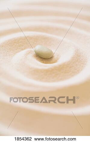 Pebble in the sand View Large Photo Image Stock Image - Pebble in the sand. Fotosearch